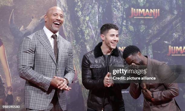 The actors Dwayne Johnson , Nick Jonas and Kevin Hart attend the German premiere of the movie 'Jumanji: Welcome to the Jungle' in Berlin, Germany, 06...