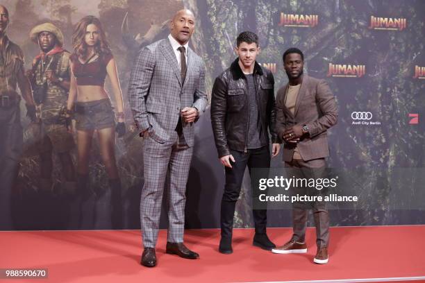 The actors Dwayne Johnson , Nick Jonas and Kevin Hart attend the German premiere of the movie 'Jumanji: Welcome to the Jungle' in Berlin, Germany, 06...