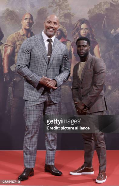 The actors Dwayne Johnson and Kevin Hart attend the German premiere of the movie 'Jumanji: Welcome to the Jungle' in Berlin, Germany, 06 December...