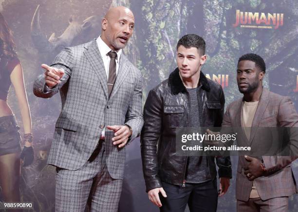 The actors Dwayne Johnson , Nick Jonas and Kevin Hart attend the German premiere of the movie 'Jumanji: Welcome to the Jungle' in Berlin, Germany, 06...