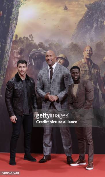 The actors Nick Jonas , Dwayne Johnson and Kevin Hart attend the German premiere of the movie 'Jumanji: Welcome to the Jungle' in Berlin, Germany, 06...