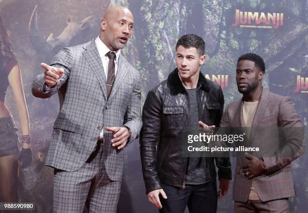 The actors Dwayne Johnson , Nick Jonas and Kevin Hart attend the German premiere of the movie 'Jumanji: Welcome to the Jungle' in Berlin, Germany, 06...