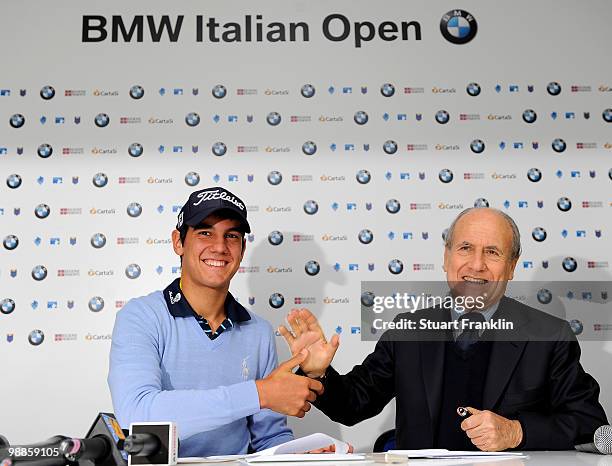 Matteo Manassero of Italy shakes hands with Franco Chimenti, president of the Italian golf federation during a press conference prior to starting his...
