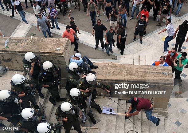 Greek riot policemen clash with protestors in the center of Athens on May 5, 2010. A nationwide general strike gripped Greece in the first major test...