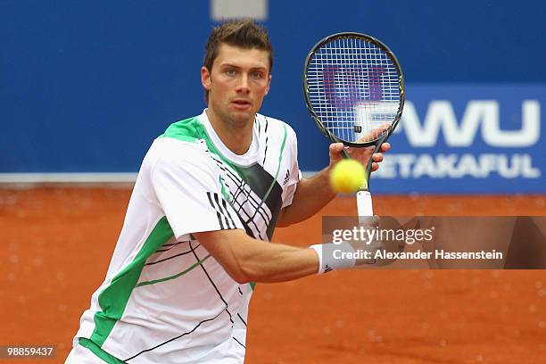Daniel Brands of Germany plays a backhand during his match against Philipp Kohlschreiber of Germany at day 4 of the BMW Open at the Iphitos tennis...