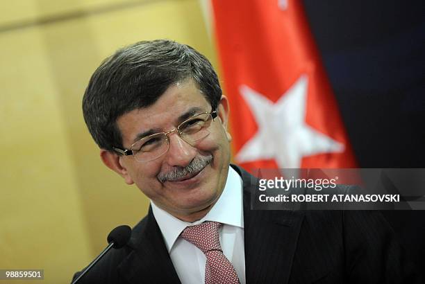 Turkey's Foreign Minister Ahmet Davutoglu and his Macedonian counterpart Antonio Milososki speak at a press conference in Skopje on March 26,2010....