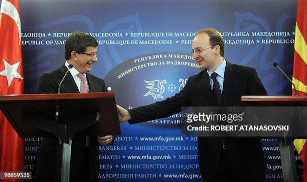 Turkey's Foreign Minister Ahmet Davutoglu and his Macedonian counterpart Antonio Milososki speak during a press conference in Skopje on March 26,...