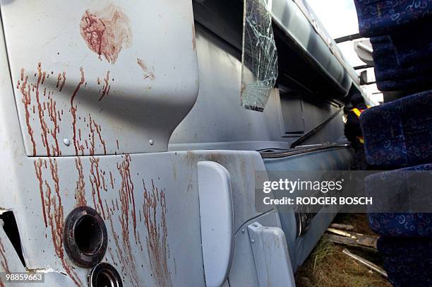 Blood stains are pictured in the wreckage of a bus after its accident on the N1 on May 5, 2010 between De Doorns and Touws River some 150 kms north...