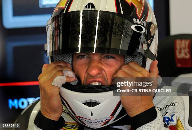 Honda's French rider Randy De Puniet puts his helmet during a free practice session at Jerez de la Frontera's circuit on April 30, 2010. The Spanish...