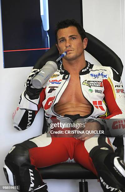 Honda's French rider Randy De Puniet sits in the pits during a free practice session at Jerez de la Frontera's circuit on April 30, 2010. The Spanish...
