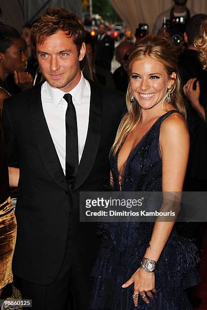 Actor Jude Law and actress Sienna Miller attend the Costume Institute Gala Benefit to celebrate the opening of the "American Woman: Fashioning a...