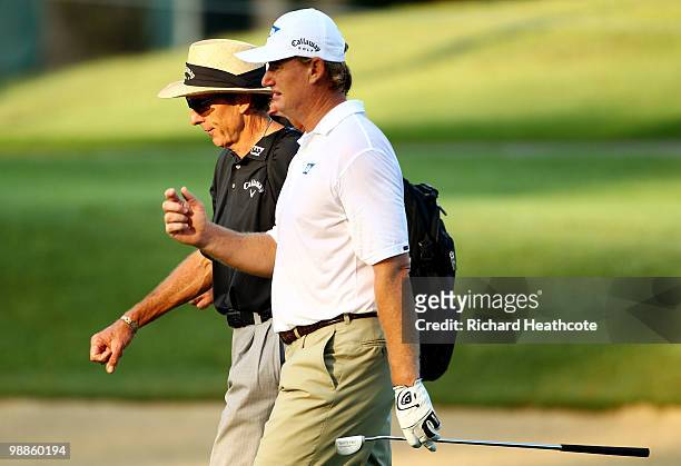 Ernie Els of South Africa walks with golf instructor David Leadbetter during a practice round prior to the start of THE PLAYERS Championship held at...