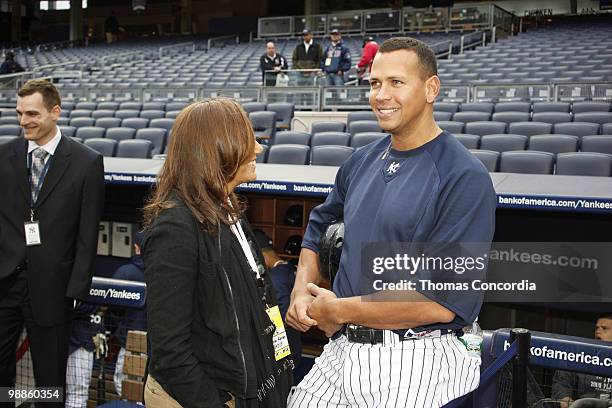 Donna Karan and Yankee Infielder Alex Rodriguez pose for a photo at Yankee Stadium on April 16, 2010 in Bronx borough of New York City.