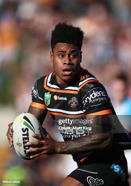 Kevin Naiqama of the Tigers makes a break during the round 16 NRL match between the Wests Tigers and the Gold Coast Titans at Leichhardt Oval on July...