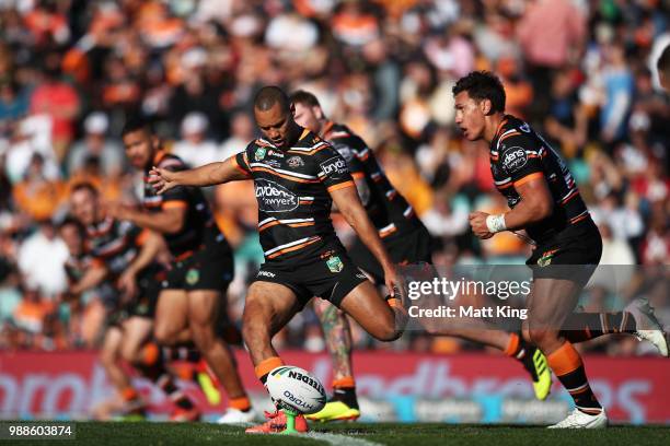 Moses Mbye of the Tigers kicks off during the round 16 NRL match between the Wests Tigers and the Gold Coast Titans at Leichhardt Oval on July 1,...