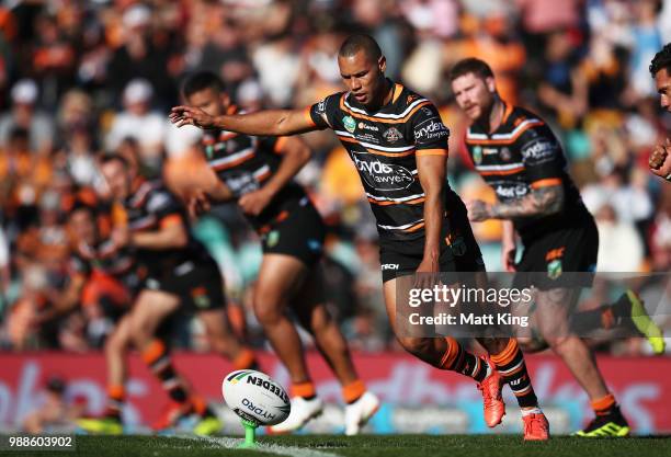 Moses Mbye of the Tigers kicks off during the round 16 NRL match between the Wests Tigers and the Gold Coast Titans at Leichhardt Oval on July 1,...