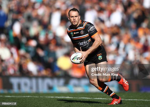 Josh Reynolds of the Tigers runs with the ball during the round 16 NRL match between the Wests Tigers and the Gold Coast Titans at Leichhardt Oval on...