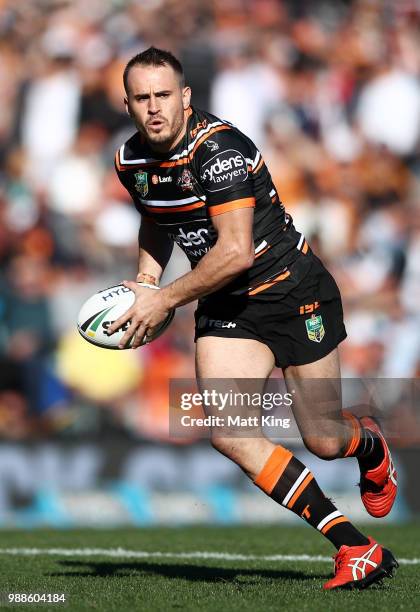 Josh Reynolds of the Tigers runs with the ball during the round 16 NRL match between the Wests Tigers and the Gold Coast Titans at Leichhardt Oval on...