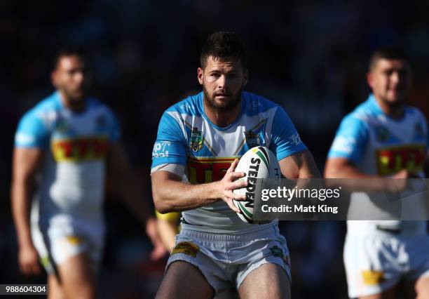 Anthony Don of the Titans runs with the ball during the round 16 NRL match between the Wests Tigers and the Gold Coast Titans at Leichhardt Oval on...