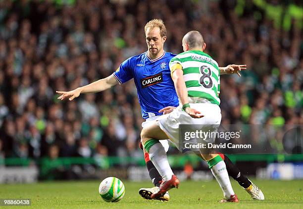 Steven Whittaker of Rangers faced by Scott Brown of Celtic during the Clydesdale Bank Scottish Premier League match between Celtic and Rangers at...