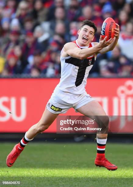 Josh Battle of the Saints marks during the round 15 AFL match between the Melbourne Demons and the St Kilda Saints at Melbourne Cricket Ground on...