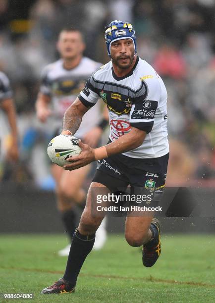 Johnathan Thurston of the Cowboys runs the ball during the round 16 NRL match between the South Sydney Rabbitohs and the North Queensland Cowboys at...