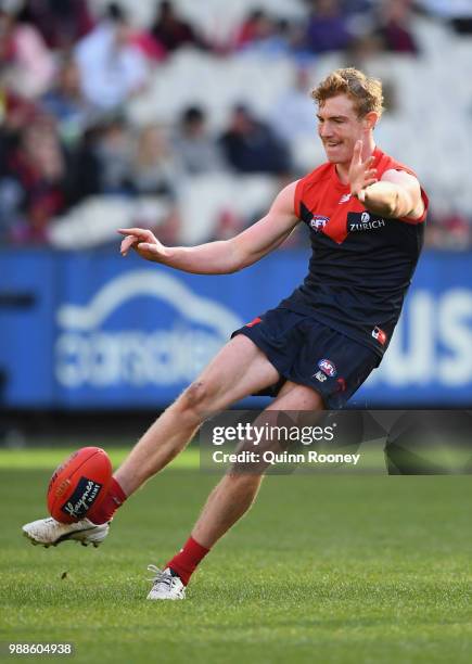 Harrison Petty of the Demons kicks during the round 15 AFL match between the Melbourne Demons and the St Kilda Saints at Melbourne Cricket Ground on...