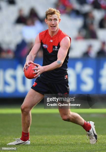 Harrison Petty of the Demons kicks during the round 15 AFL match between the Melbourne Demons and the St Kilda Saints at Melbourne Cricket Ground on...