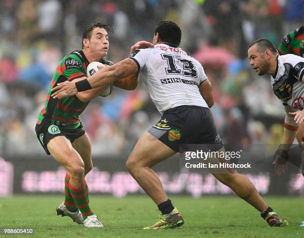 Cameron Murray of the Rabbitohs is tackled by Jason Taumalolo of the Cowboys during the round 16 NRL match between the South Sydney Rabbitohs and the...