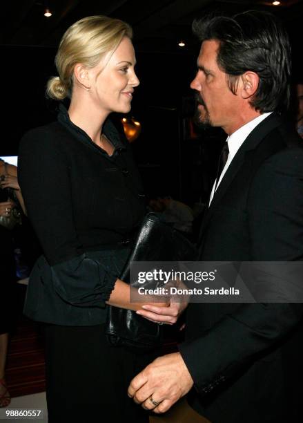 Actress Charlize Theron and actor Josh Brolin attend the Dior and Vanity Fair launch of BRANDAID Foundation held at Environment on February 19, 2009...