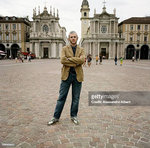 The writer and journalist Giuseppe Culicchia poses for a portraits session in San Carlo square on August 22, 2008 in Turin, Italy.