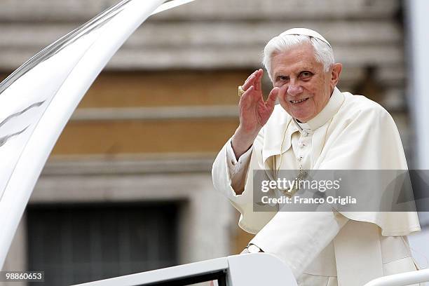 Pope Benedict XVI waves to the faithful gathered in St. Peter's Square during his weekly audience, on May 5, 2010 in Vatican City, Vatican. At the...