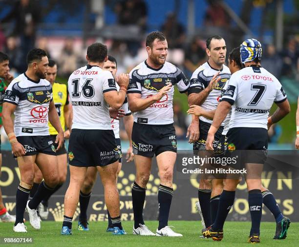 Gavin Cooper of the Cowboys celebrates after scoring a try during the round 16 NRL match between the South Sydney Rabbitohs and the North Queensland...