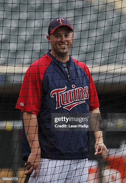 Michael Cuddyer of the Minnesota Twins works out prior to the start of the game against the Detroit Tigers on May 4, 2010 at Target Field in...