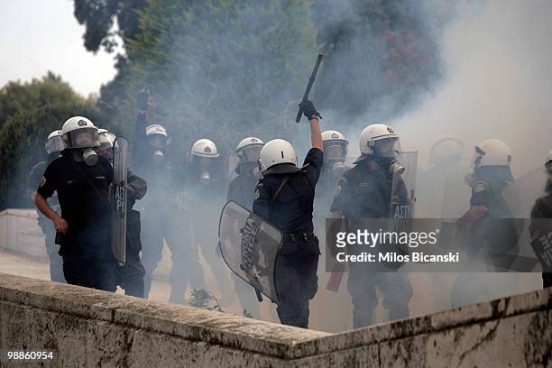 Greek riot police deploy tear gas on May 5, 2010 in Athens, Greece. Three people have died after protesters set fire to the Marfin Egnatia Bank in...