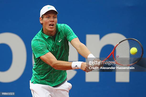 Tomas Berdych of Czech Republic plays a backhand during his match against Pere Riba of Spain at day 4 of the BMW Open at the Iphitos tennis club on...