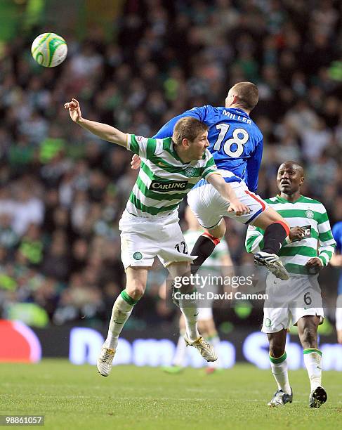 Kenny Miller of Rangers beats Mark Wilson of Celtic during the Clydesdale Bank Scottish Premier League match between Celtic and Rangers at Celtic...