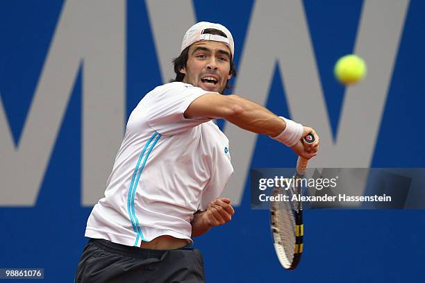 Pere Riba of Spain plays a forehand during his match against Tomas Berdych of Czech Republic at day 4 of the BMW Open at the Iphitos tennis club on...