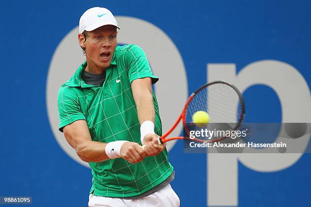 Tomas Berdych of Czech Republic plays a backhand during his match against Pere Riba of Spain at day 4 of the BMW Open at the Iphitos tennis club on...