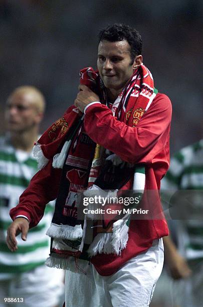 Ryan Giggs of Man Utd collects scarves from the fans after the Manchester United v Celtic Ryan Giggs Testimonial match at Old Trafford, Manchester....