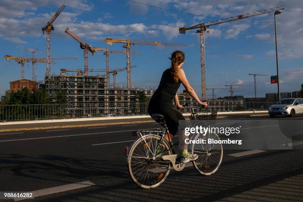 Cyclist passes the Europacity project residential building site in Berlin, Germany, on Wednesday, June 27, 2018. In a rough-and-tumble corner of...