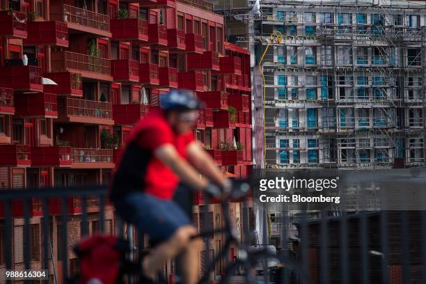 Scaffolding surrounds a residential apartment block construction site in the Schoeneberg district of Berlin, Germany, on Wednesday, June 27, 2018. In...