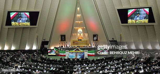 General view shows Iranian President Mahmoud Ahmadinejad taking the oath of office during a swearing-in ceremony at the parliament in Tehran on...