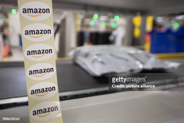 Stickers reading "Amazon" are on display during the media day of the electronic commerce giant Amazon, in Bad Hersfeld, Germany, 7 December 2017....
