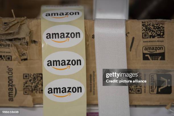 Stickers reading "Amazon" are on display during the media day of the electronic commerce giant Amazon, in Bad Hersfeld, Germany, 7 December 2017....