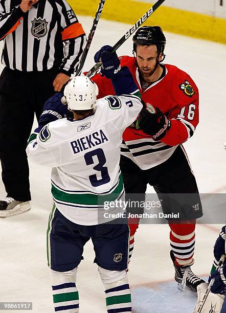 Andrew Ladd of the Chicago Blackhawks spars with Kevin Bieksa of the Vancouver Canucks in Game Two of the Western Conference Semifinals during the...