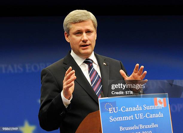 Canadian Prime Minister Stephen Harper gestures as he gives a press conference on May 5, 2010 at the end of his meeting at the European Union Council...