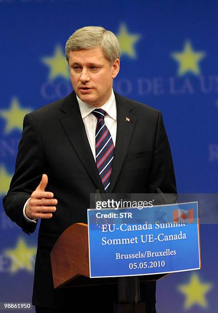 Canadian Prime Minister Stephen Harper gestures as he gives a press conference on May 5, 2010 at the end of his meeting at the European Union Council...