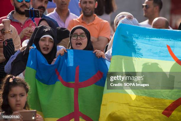 Group of Muslim women shout against the condemnation of Nasser Zefzafi with flags of the Amazigh people. Protest against a sentence of 20 years...