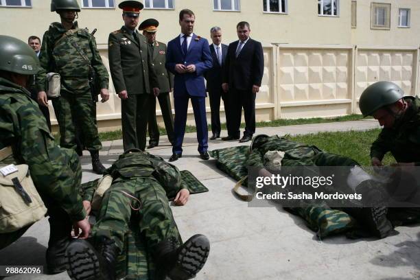 Russian President Dmitry Medvedev and Defence Minister Anatoly Serdyukov visit a firing range of the 5th Taman motorized infantry brigade on May 5,...